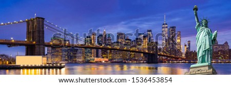 Panorama Statue of liberty Brooklyn bridge with Lower Manhattan skyscrapers bulding for New York City in New York State NY , USA
