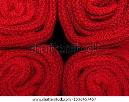 Sweater or scarf texture large knitting. Knitted jersey background with a relief pattern. Braids in knitting. Wool hand-knitted or machine knitting pattern. Fabric Background.