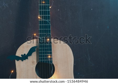Halloween guitar with garland and bat, Halloween background,