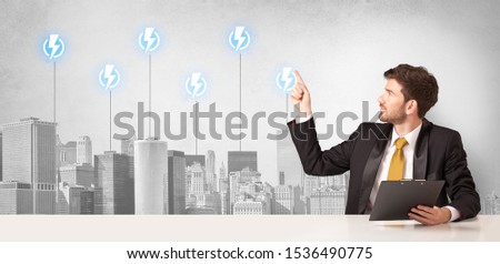 Announcer sitting at desk presenting the city energy consumption