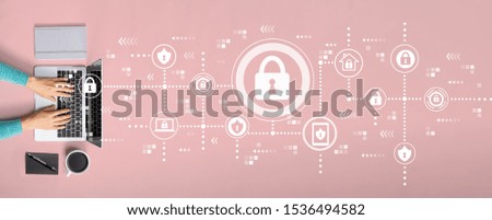 Cyber security theme with person using a laptop