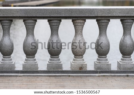 stone columns of the fence in the park