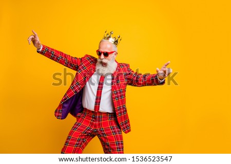 Photo of cool look grandpa white beard vip guy dancing strange youth moves little drunk wear crown sun specs plaid red blazer tie pants outfit isolated yellow color background Royalty-Free Stock Photo #1536523547