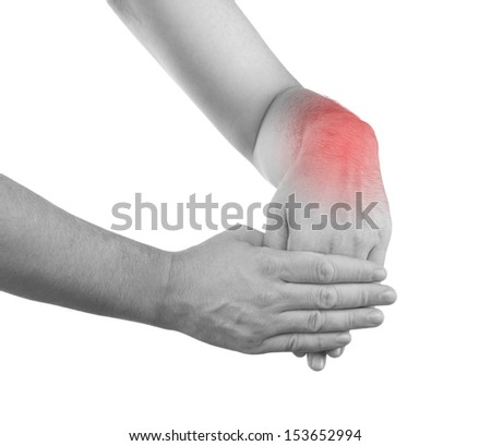 Pain in a man wrist. Male holding hand to spot of wrist pain. 