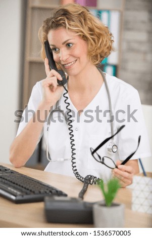 friendly medical worker on the telephone
