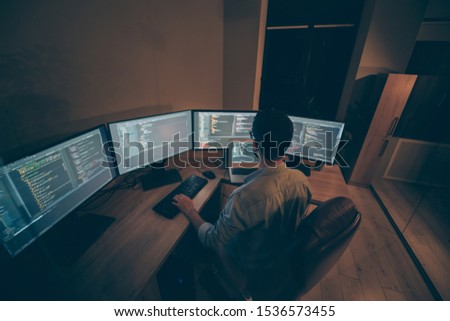Top above high angle view photo of entrepreneur having studied to be programmer knowing how C++ works engaging laptop in work surrounded with screens concentrated on debugging