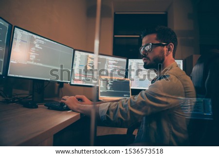 Photo of it-specialist hired serious for solving all the back-end failures occurred after restarting corporation web site working on optimization software to work using different operational systems