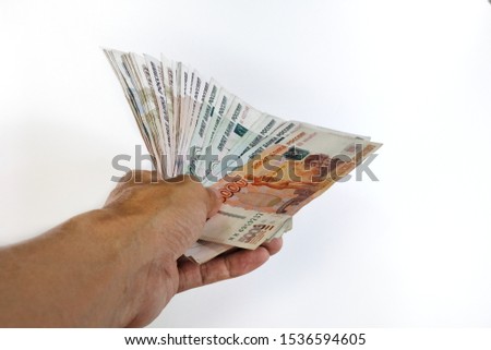Hands holding Russian rouble currency banknotes Close up photo  ,Financial and investment concepts