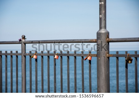 Padlocks on the railings at the pier in Miedzyzdroje. poland.