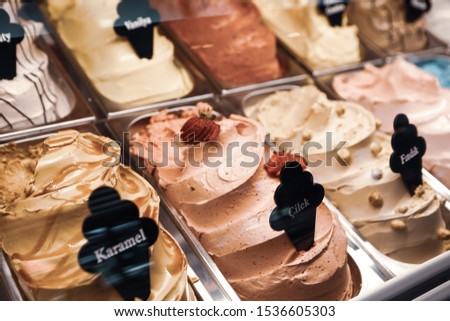 bar with many flavors of delicious ice cream for sale