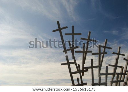 many crosses in the sky with clouds
