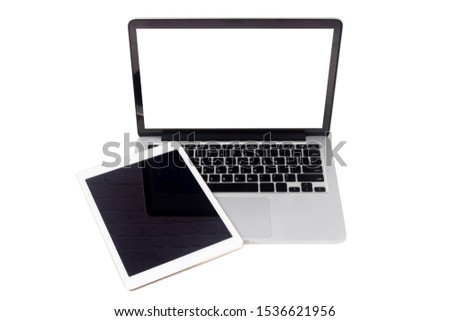 above laptop, notebook and tablet with blank screen on isolated white background with clipping path.