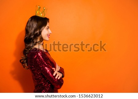 Profile side photo of confident cool prom princess having golden crown on her head cross hands feel she real beauty vogue queen wear stylish glamorous clothing isolated over orange color background
