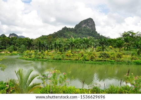 Across the valley, near Krabi. Lakes and hills make up the landscape of this area of South Western Thailand
