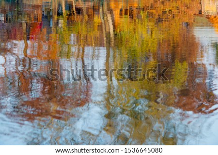 Autumn reflections. View of colorful forest across water surface. Natural watercolor.