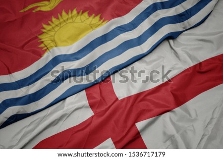 waving colorful flag of england and national flag of Kiribati . macro