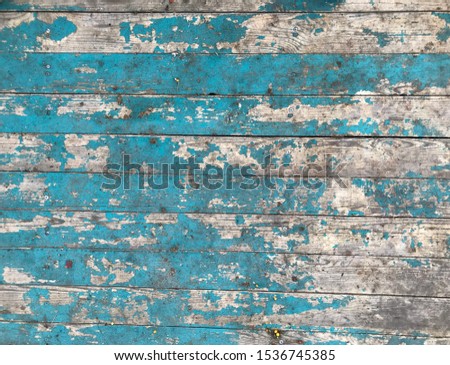 Colorful wooden planks background. Vintage turquoise blue old wood tiles. Aged worn out teal color surface. Rough damaged hardwood floor