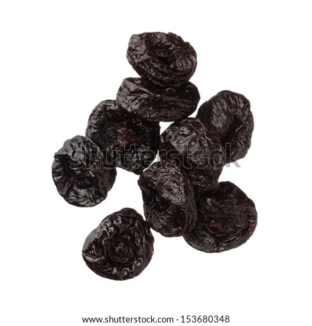Isolated dried plums over white background, close up