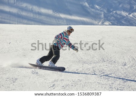 Snowboarding in the alps at a ski resort