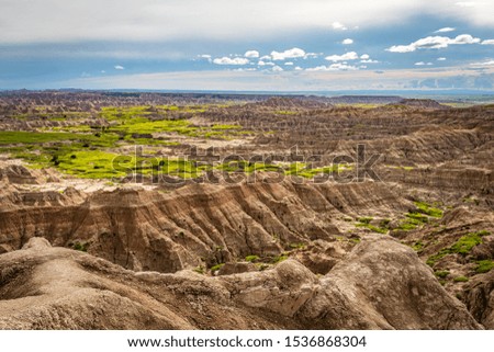 Badlands National Park is located in southwestern South Dakota, featuring nearly 400 square miles of sharply eroded buttes and pinnacles, and the largest undisturbed grass prairie in the United States