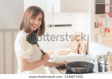 Happy women in the kitchen Cooking fashion set