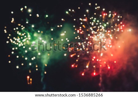 Fireworks at New Year and copy space abstract holiday background. Brightly Colorful Fireworks on twilight background with free space for text. New Year