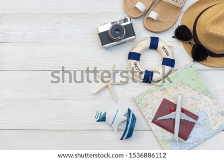 Top view of Traveler accessories and items  with tourism backpack and visiting for planning trips travel destination and vacations on the world, copy space.  Travel and Summer holiday concept 