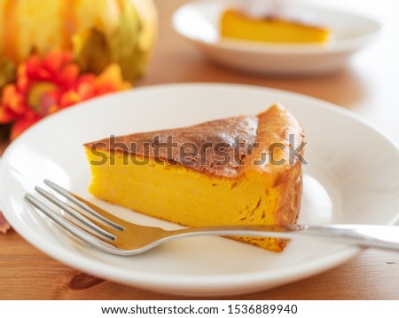 Pumpkin cheesecake on white plate