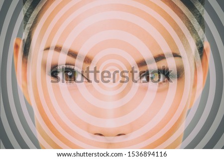 Hypnosis hypnotize spiral over woman face for mind control. Royalty-Free Stock Photo #1536894116