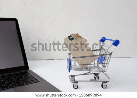 Creative promotion composition for online shopping sale on white background with laptop and grocery cart. mockup, template