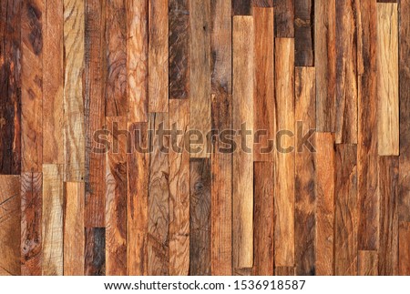 Mosaic of old wooden slats, wooden planks. Brown slats, planch, bred wall. Vintage rustic close-up wood texture.