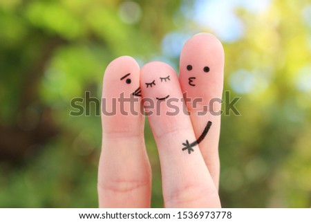 Fingers art. Concept boys kisses of girl on cheek. Royalty-Free Stock Photo #1536973778