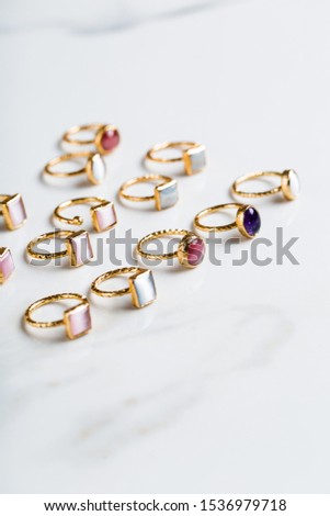 Fashion jewellery, assorted classy colorful rings for summer with natural gemstones isolated on white background