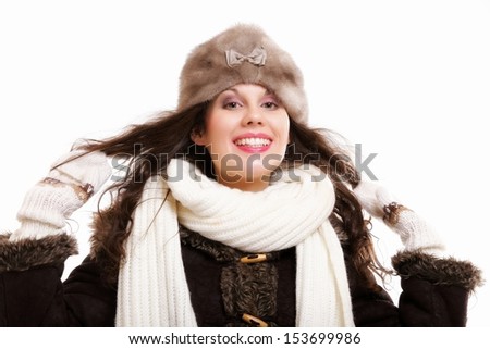 winter fashion portrait beautiful woman in warm clothing in fur hat muffler isolated on white background