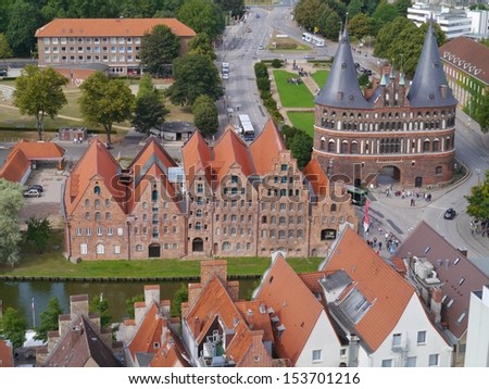 A panoramic view from the tower of the St Petri church over Lubeck in Germany with the Holsten gate and the salt storehouses
