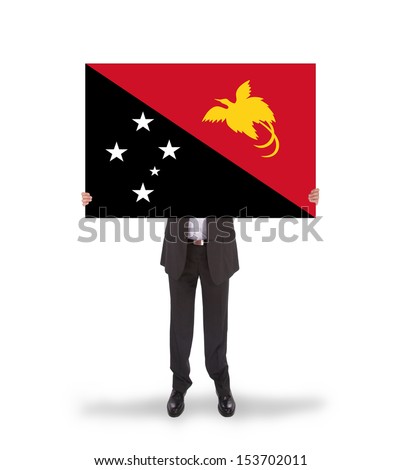 Businessman holding a big card, flag of Papua New Guinea, isolated on white