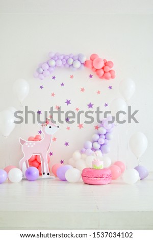 Decorations for holiday party. A lot of balloons pink and white colors.