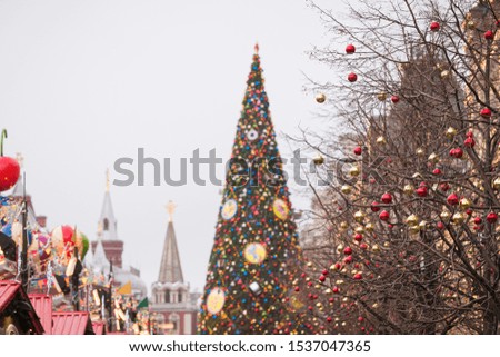 Christmas holiday decorations in the center of Moscow. Christmas toys hang on the branches of spruce, and garlands sparkle in different colors. Winter and holidays concept. Red Square, Moscow, Russia