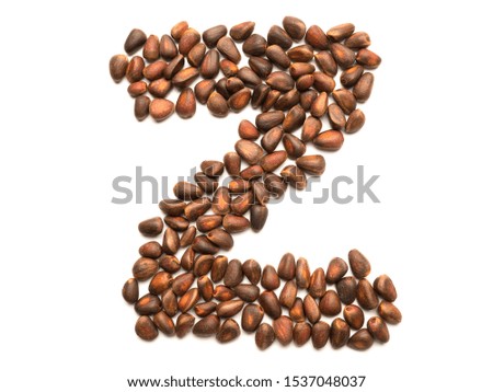 Letter made from unpeeled cedar nuts. Organic product. Ingredient for a healthy diet. New Year font. Graphic resources isolated symbol in the form of the letter Z.