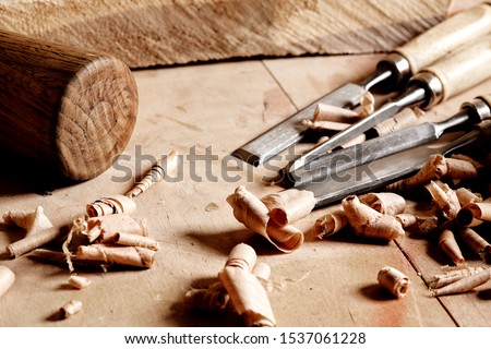 Woodworkers  shop. Woodturning project to making a handmade bowls. Craftsman skills concept. Tools and workpieces. Joiners chisels and hammer. Royalty-Free Stock Photo #1537061228