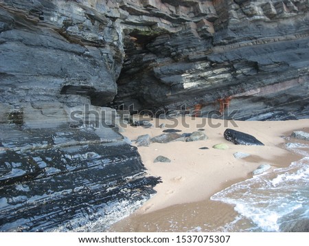 A cave in a cliff on the beach at Ballito.