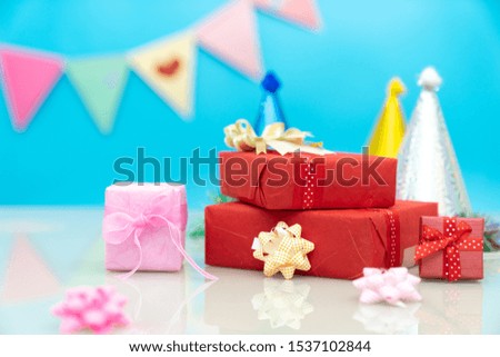 craft paper present boxes tied from rope on blue background