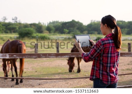 Agriculture industry farming technology and animal husbandry concept - farmer with tablet  checking quality by tablet agriculture modern technology Concept.