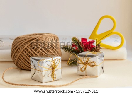 Scissors, paper, rope and other materials for the manufacture and packaging of gifts with their own hands for the holiday