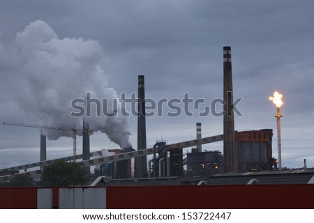 Panoramic view of heavy industry at dawn in  Asturias, North Spain.  Smokestacks in factory at dawn.