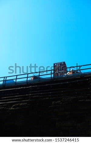View of a modern buildings over a rail bridge in Harlem, New York.