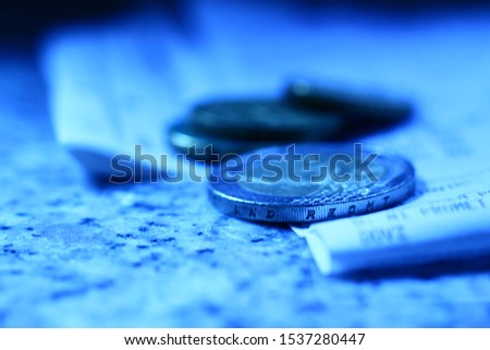 Euro coins, small coins and a store bill macro photo.