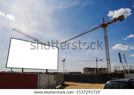 Blank white advertising billboard on the construction site