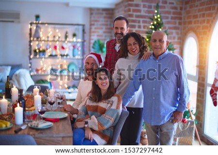 Beautiful family smiling happy and confident. Posing with tree celebrating Christmas at home