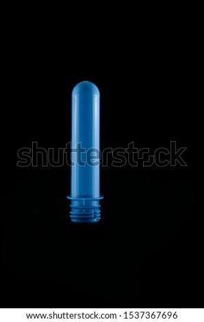 Blue plastic capsule on black background